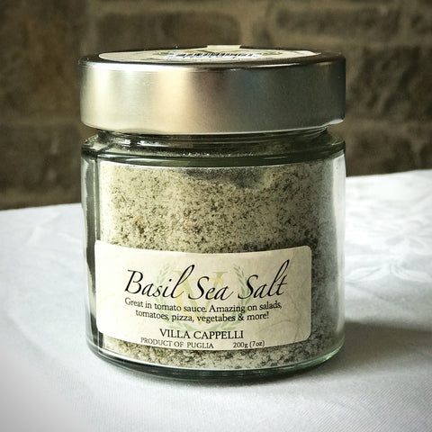 A jar of Villa Cappelli Basil Sea Salt sitting on a table.
