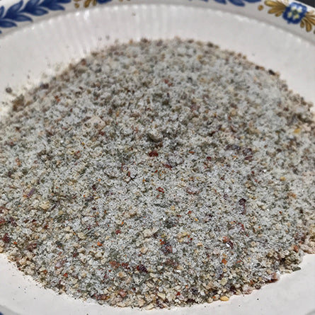 A bowl of Villa Cappelli Grilling Salt in a blue and white pattern.