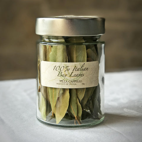 A jar of Italian Bay Leaves by Villa Cappelli on a table.